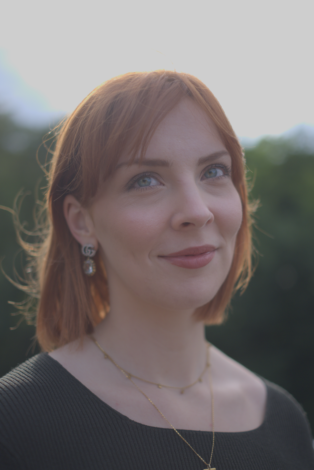 The same portrait with proper Reinhard tone mapping applied. Skin tones are bright and natural; highlights are compressed without clipping; shadows have visible detail.