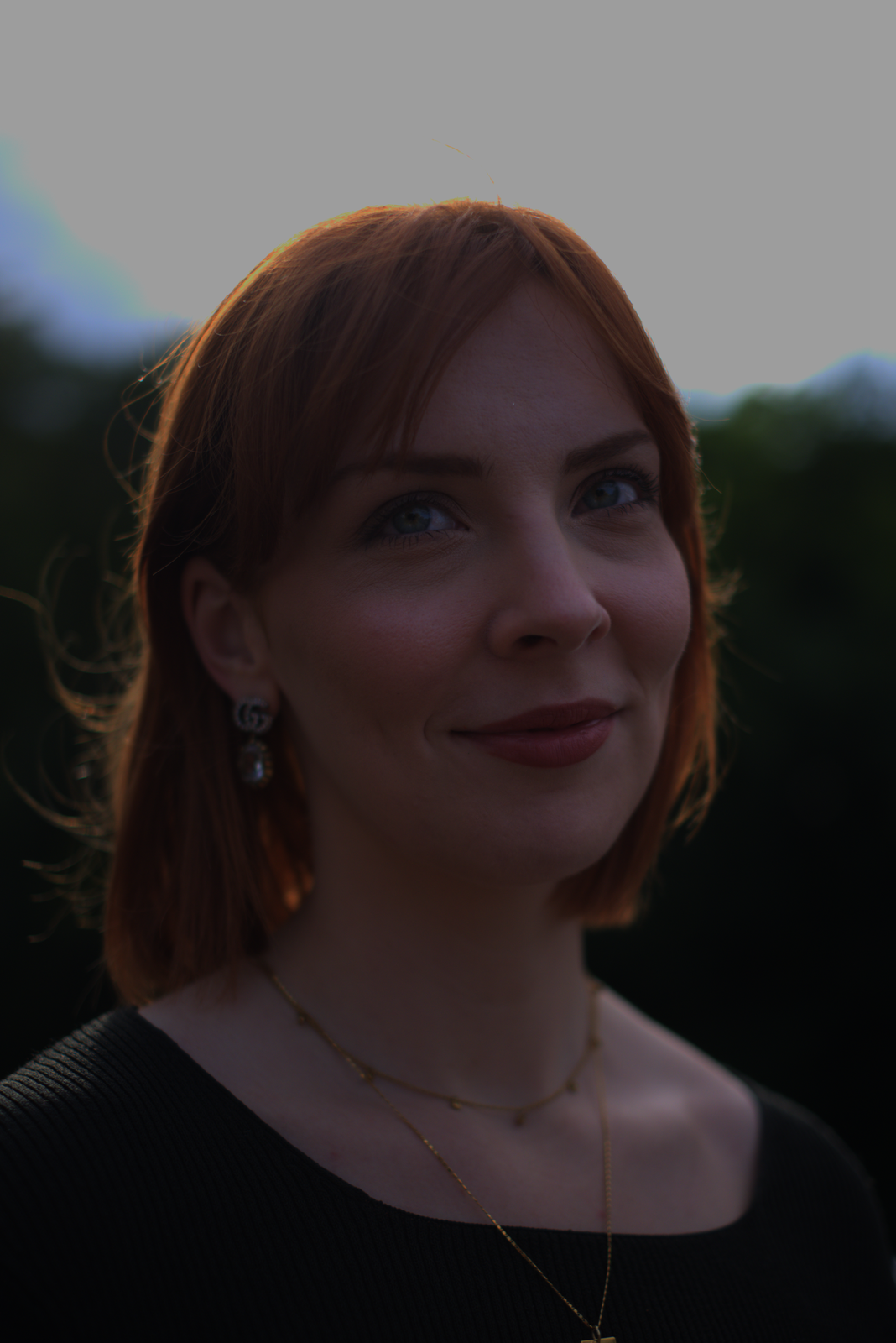 The portrait with no gamma encoding applied — just the linear post-tone-map values written to 8-bit. The image is severely shadow-crushed; mid-tones are nearly black.